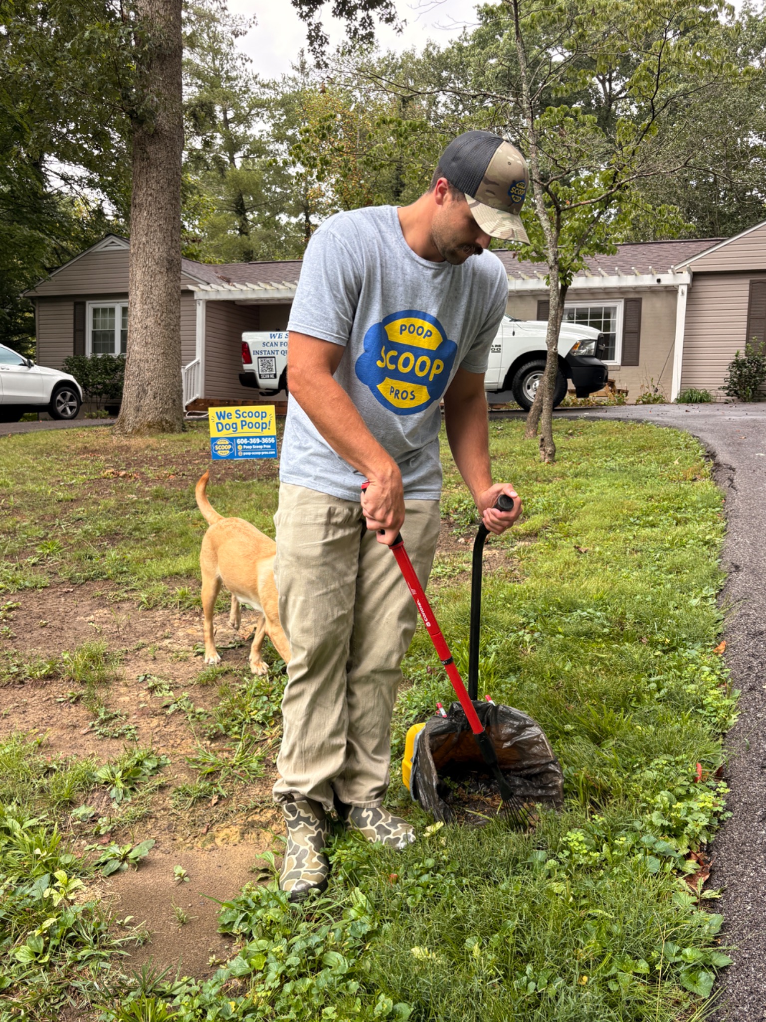 Poop Scoop Pros technician providing dog waste removal service